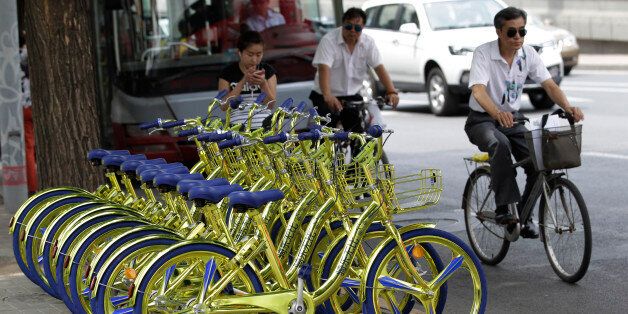 BEIJING, CHINA - JUNE 08:  Golden sharing bikes of a bike-sharing service are available on the street at Chaoyang District on June 8, 2017 in Beijing, China. Golden sharing bikes equipped with wireless charge modules could charge mobile phones in Beijing.  (Photo by VCG/VCG via Getty Images)
