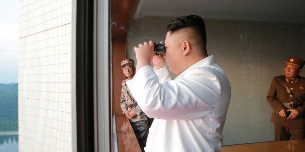 North Korean leader Kim Jong Un looks on during a ballistic rocket test-fire through a precision control guidance system in this undated photo released by North Korea's Korean Central News Agency (KCNA) May 30, 2017. KCNA/via REUTERS ATTENTION EDITORS - THIS IMAGE WAS PROVIDED BY A THIRD PARTY. EDITORIAL USE ONLY. REUTERS IS UNABLE TO INDEPENDENTLY VERIFY THIS IMAGE. NO THIRD PARTY SALES. SOUTH KOREA OUT.
