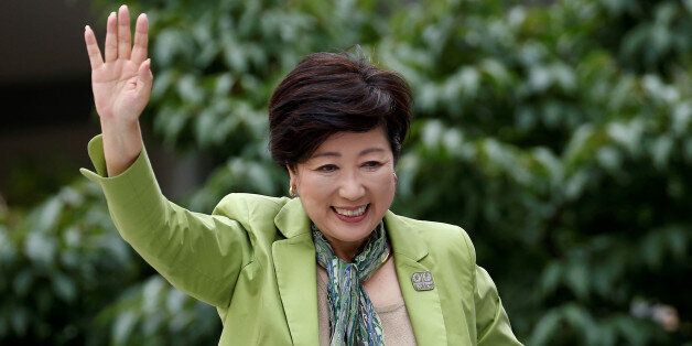 Tokyo Governor and head of Tokyo Citizens First party Yuriko Koike waves to voters atop of a campaign van as election campaign officially kicks off for Tokyo Metropolitan Assembly election, on the street in Tokyo June 23, 2017.    REUTERS/Issei Kato
