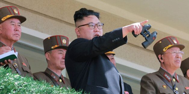 TOPSHOT - This undated picture released from North Korea's official Korean Central News Agency (KCNA) on April 14, 2017 shows North Korean leader Kim Jong-Un (C) inspecting the 'Dropping and Target-striking Contest of KPA Special Operation Forces - 2017' at an undisclosed location in North Korea.North Korean leader Kim Jong-Un has overseen a special forces commando operation, state media said on April 13, as tensions soar with Washington over Pyongyang's nuclear programme. / AFP PHOTO / KCNA VIA