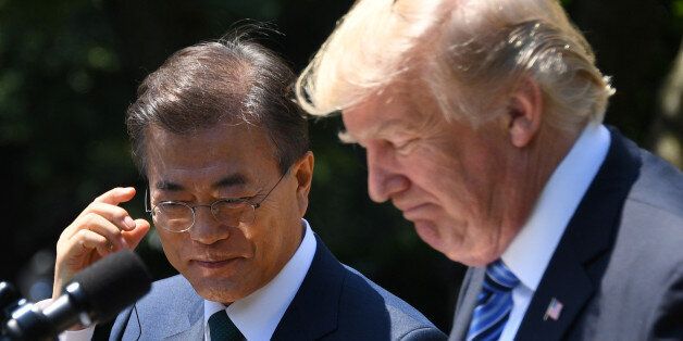 US President Donald Trump (R) and South Korean President Moon Jae-in look on during a joint press conference in the Rose Garden at the White House in Washington, DC, on June 30, 2017. / AFP PHOTO / JIM WATSON        (Photo credit should read JIM WATSON/AFP/Getty Images)