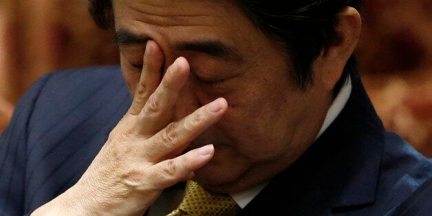 Japan's Prime Minister Shinzo Abe attends a lower house committee session at the parliament in Tokyo February 4, 2015. Abe said on Wednesday he was deeply angry over the