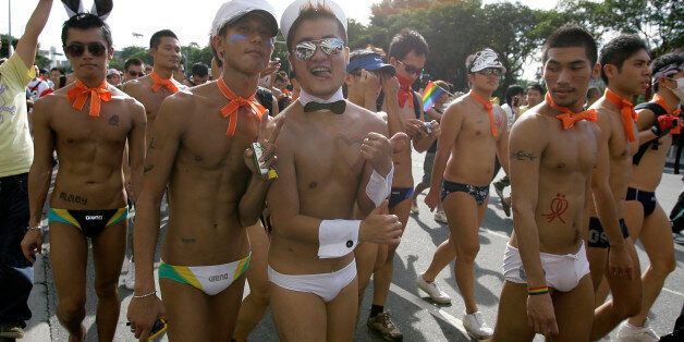 Participants attend the Taiwan Gay Pride Parade in Taipei October 31, 2009. Around 25,000 Taiwanese gathered with people from countries including Malaysia, Korea and Japan on Saturday for the annual gay pride parade which is in its seventh year, according to organisers.  REUTERS/Pichi Chuang (TAIWAN SOCIETY IMAGES OF THE DAY)