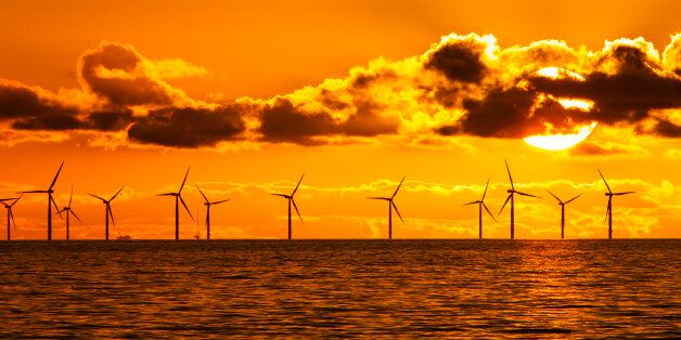 MORECAMBE BAY, UNITED KINGDOM - FEBRUARY 06: Sunset over the Walney offshore Wind farm from Walney island showing both the wind turbines and a gas platform further out in Morecambe Bay on February 06, 2017 in Morecambe Bay, England .The windfarm will shortly be the largest offshore wind farm in the world and currently generates 367 MW.PHOTOGRAPH BY Ashley Cooper / Barcroft ImagesLondon-T:+44 207 033 1031 E:hello@barcroftmedia.com -New York-T:+1 212 796 2458 E:hello@barcroftusa.com -New Delhi-T:+