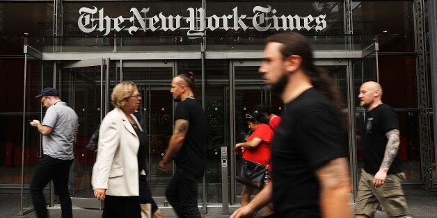 NEW YORK, NY - JULY 27:  People walk past the New York Times building on July 27, 2017 in New York City.  The New York Times Company shares have surged to a nine-year high after posting strong earnings on Thursday. Partly due to new digital subscriptions following the election of Donald Trump as president, the company reported a profit of $27.7 million in the second quarter, up from $9.1 million in the same period last year.  (Photo by Spencer Platt/Getty Images)