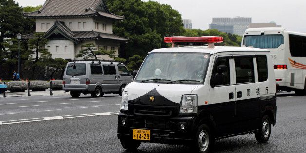 A police car of Suzuki Motor - Every, drives past the Imperial Palace in Tokyo, Japan June 1, 2017. REUTERS/Toru Hanai