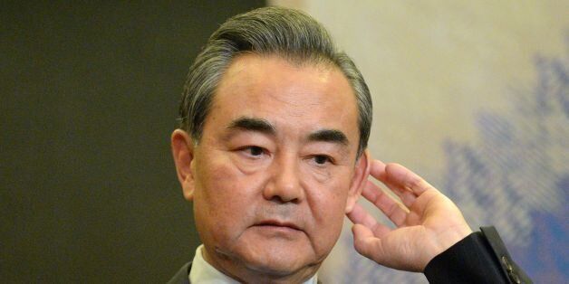 China's Foreign Minister Wang Yi gestures during a press conference on the sidelines of the 50th Association of Southeast Asian Nations (ASEAN) regional security forum in suburban Manila on August 6, 2017.The annual forum, hosted by the Association of Southeast Asian Nations (ASEAN), brings together the top diplomats from 26 countries and the European Union for talks on political and security issues in Asia-Pacific. / AFP PHOTO / TED ALJIBE        (Photo credit should read TED ALJIBE/AFP/Getty Images)