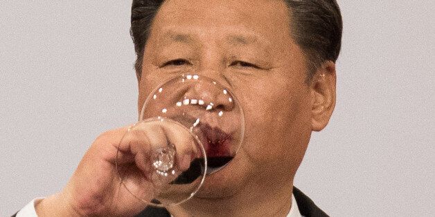 China's President Xi Jinping drinks wine as he makes a toast during a banquet in Hong Kong, China June 30, 2017. REUTERS/Dale de la Rey/Pool