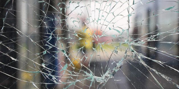 Glass broken cracks splinters in front of the bus station