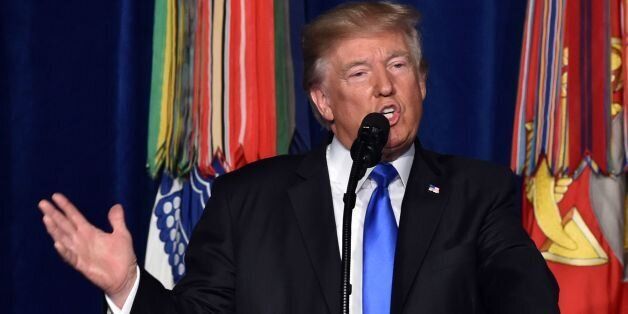 US President Donald Trump speaks during his address to the nation from Joint Base Myer-Henderson Hall in Arlington, Virginia, on August 21, 2017.Trump Monday left the door open to a possible political agreement with the Taliban, in an address to the nation on America's strategy in the 16-year Afghan conflict. 'Some day, after an effective military effort, perhaps it will be possible to have a political sentiment that includes elements of the Taliban in Afghanistan,' he said. / AFP PHOTO / Nichol