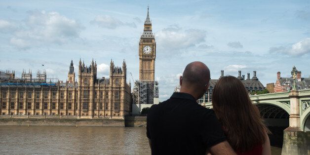 A couple hug agains the backdrop of the Elizabeth Tower, known as 'Big Ben' and the Houses of Parliament, in London on August 14, 2017. The bongs of the iconic bell will be stopped to protect workers during a four-year, Â£29m-conservation project that includes repair of the Queen Elizabeth Tower, which houses the Great Clock and its bell. The familiar bongs will fall silent after sounding at noon 21 August, and are set to begin again regularly in 2021. (Photo by Alberto Pezzali/NurPhoto via Ge