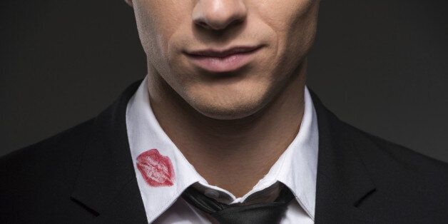 Man with lipstick on his collar