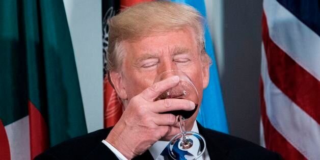 US President Donald Trump sips a glass after making a toast during a luncheon at the United Nations headquarters during the 72nd session of the United Nations General Assembly September 19, 2017 in New York. / AFP PHOTO / Brendan Smialowski        (Photo credit should read BRENDAN SMIALOWSKI/AFP/Getty Images)