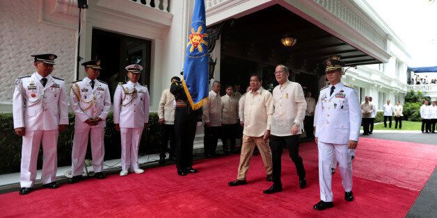 MANILA, PHILIPPINES - JUNE 30: In this handout image provided by Malacanang Photo Bureau, Outgoing President Benigno S. Aquino III reviews the honor guards during the Departure Honors at the Malacanan Palace Grounds on June 30, 2016 in Manila, Philippines. Rodrigo Duterte, a city mayor also known as 'The Punisher', was sworn in as the 16th president of the Philippines on Thursday to serve a six-year term while promising to get rid of crime and corruption. (Photo by Benhur Arcayan/Malacanang Phot
