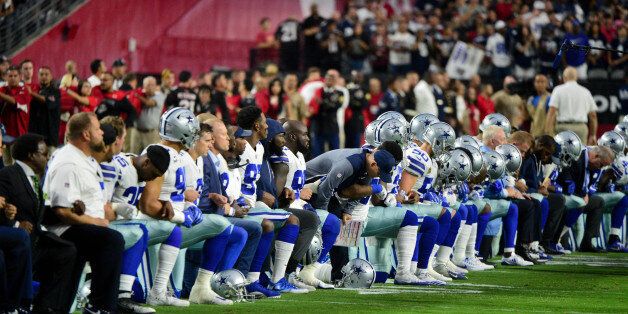 Sep 25, 2017; Glendale, AZ, USA; The Dallas Cowboys players, coaches and staff take a knee prior to the National Anthem before the game against the Arizona Cardinals at University of Phoenix Stadium. Mandatory Credit: Matt Kartozian-USA TODAY Sports