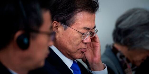 South Korea's President Moon Jae-in listens to a statement before luncheon with US, Korean, and Japanese leaders at the Palace Hotel during the 72nd United Nations General Assembly September 21, 2017 in New York City. / AFP PHOTO / Brendan Smialowski        (Photo credit should read BRENDAN SMIALOWSKI/AFP/Getty Images)