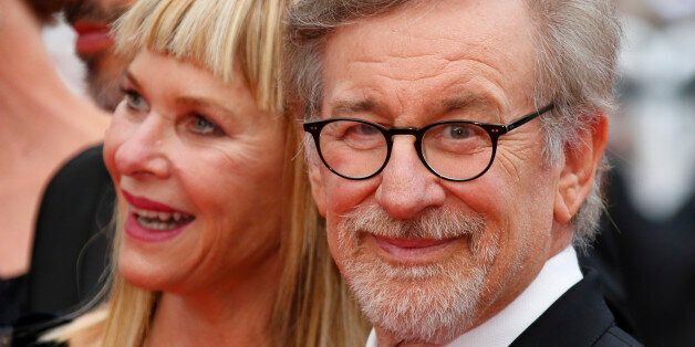 Director Steven Spielberg and his wife Kate Capshaw pose on the red carpet as they arrive for the screening of the film