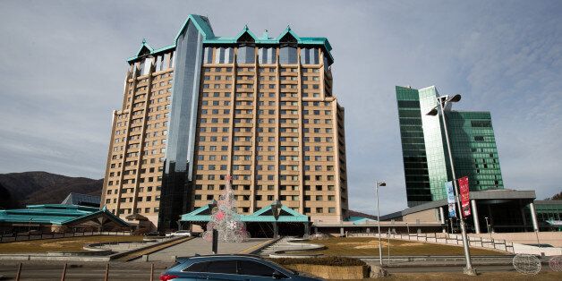 A vehicle drives past Kangwon Land Corp. hotel and casino building in Sabuk, Jeongseon, South Korea, on Wednesday, Dec. 21, 2016. The proliferation of gambling addicts in Sabuk is serving as a warning for lawmakers in South Korea -- and more recently Japan -- enticed by the potential for tax revenues and economic gains. Photographer: SeongJoon Cho/Bloomberg via Getty Images