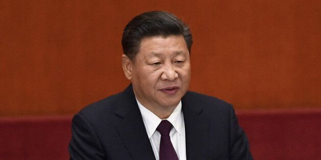 China's President Xi Jinping gives a speech at the opening session of the Chinese Communist Party's five-yearly Congress at the Great Hall of the People in Beijing on October 18, 2017.President Xi Jinping declared China is entering a 'new era' of challenges and opportunities on October 18 as he opened a Communist Party congress expected to enhance his already formidable power. / AFP PHOTO / WANG Zhao        (Photo credit should read WANG ZHAO/AFP/Getty Images)