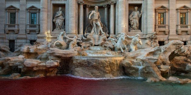 ROME, ITALY - OCTOBER 26: A blood-red dye was poured by public-artist Graziano Cecchini into the Trevi's fountain (Fontana di Trevi) as demonstrative act on October 26, 2017 in Rome, Italy. Rome police identified Graziano Cecchini and placed him under investigation for damaging a historical and artistic building.(Photo by Antonio Masiello/Getty Images)