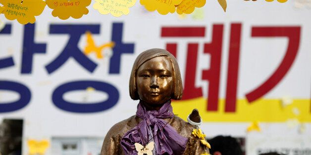 SEOUL, SOUTH KOREA - AUGUST 14:  The Statue of Girl stands on the Peace Road, in front of Japanese Embassy on August 14, 2016 in Seoul, South Korea. The activists held a ceremony to mark the 25th anniversary of Kim Hak-sun's comfort women testimony amid the talks between ministers of Japan and South Korea are in progress on the details how $9.9 million funds be spent for Reconciliation and Healing Foundation for the surviving comfort women.  (Photo by Woohae Cho/Getty Images)