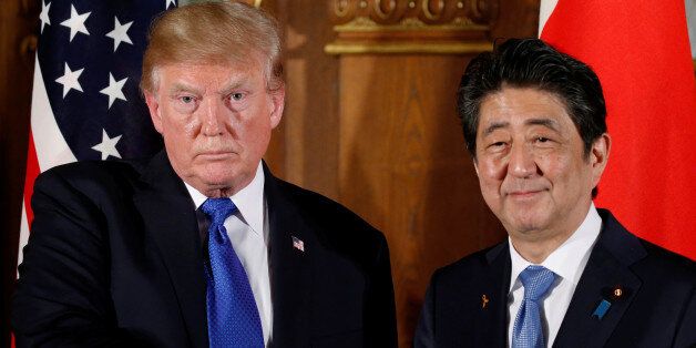 U.S. President Donald Trump and Japan's Prime Minister Shinzo Abe shake hands at the end of a news conference at Akasaka Palace in Tokyo, Japan, November 6, 2017. REUTERS/Jonathan Ernst