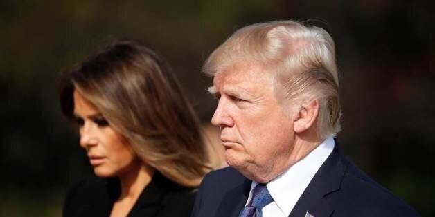 US President Donald Trump(R) and First Lady Melania pay a silent tribute at the National Cemetery in Seoul on November 8, 2017.Trump offered North Korean leader Kim Jong-Un what he called 'a path towards a much better future' as tensions soar over Pyongyang's nuclear ambitions. / AFP PHOTO / POOL / KIM Hong-Ji        (Photo credit should read KIM HONG-JI/AFP/Getty Images)