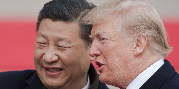 China's President Xi Jinping (L) and US President Donald Trump attend a welcome ceremony at the Great Hall of the People in Beijing on November 9, 2017. / AFP PHOTO / NICOLAS ASFOURI        (Photo credit should read NICOLAS ASFOURI/AFP/Getty Images)