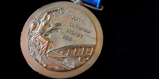 SYDNEY, AUSTRALIA - NOVEMBER 09:  The 2000 Olympic Gold Medal won by Michael Diamond as seen at Lawsons Auctioneers on November 9, 2017 in Sydney, Australia. Michael Diamond competed in six Olympic Games and is a dual Olympic gold medalist, who won the men's trap shooting at the Atlanta 1996 and Sydney 2000 Olympic Games. He is selling his Sydney Olympic medal to pay off debts after being acquitted following an 18-month legal battle over drink-driving and firearms charges.  (Photo by Lisa Maree
