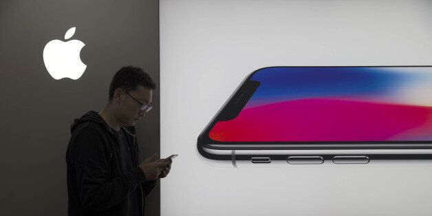 SHANGXI, CHINA - NOVEMBER 02: (CHINA MAINLAND OUT)The Apple fans is using face recognition function of iPhoneX which will come into market on 3th on 02th November, 2017 in Taiyuan, Shanxi, China.(Photo by TPG/Getty Images)