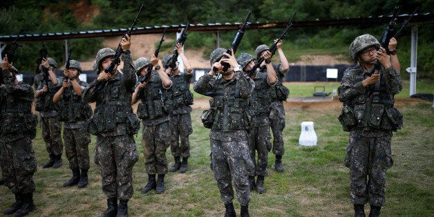 South Korean soldiers take part in a firearms training at a military base near the demilitarized zone separating the two Koreas in Paju, South Korea, July 13, 2016.  REUTERS/Kim Hong-Ji SEARCH