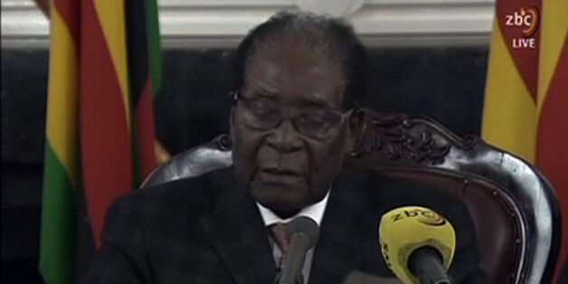 A video grab made on November 19, 2017 from footage of the broadcast of Zimbabwe Broadcasting corporation (ZBC) shows Zimbabwe's President Robert Mugabe delivering a speech in Harare, following a meeting with army chiefs who have seized power in Zimbabwe.Zimbabwean President Robert Mugabe, in a much-expected TV address, stressed he was still in power after his authoritarian 37-year reign was rocked by a military takeover. Many Zimbabweans expected Mugabe to resign after the army seized power las