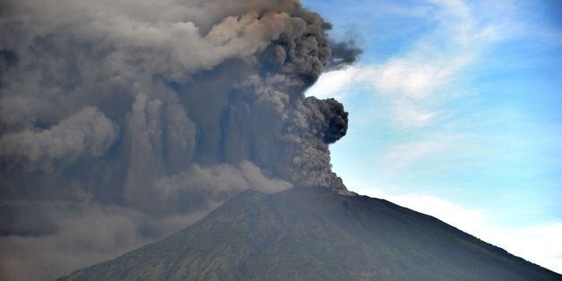 General view of Mount Agung during an eruption seen from Kubu sub-district in Karangasem Regency, on Indonesia's resort island of Bali on November 26, 2017. Mount Agung belched smoke as high as 1,500 metres above its summit, sparking an exodus from settlements near the mountain. / AFP PHOTO / SONNY TUMBELAKA        (Photo credit should read SONNY TUMBELAKA/AFP/Getty Images)