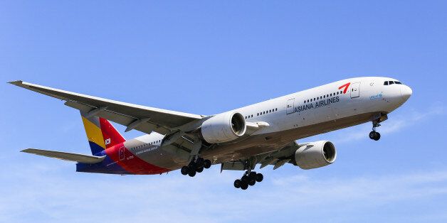 Los Angeles, USA - May 30, 2015: An airplane of Asiana Airlines (Boeing 777-200) landing at Los Angeles International Airport.