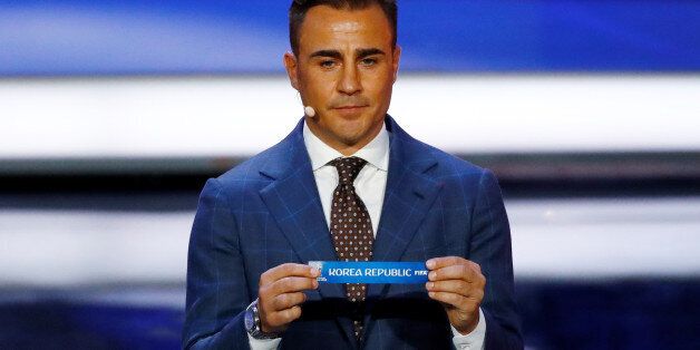 Soccer Football - 2018 FIFA World Cup Draw - State Kremlin Palace, Moscow, Russia - December 1, 2017   Fabio Cannavaro pulls out Korea Republic during the draw   REUTERS/Kai Pfaffenbach