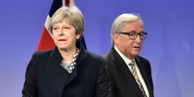 British Prime Minister Theresa May (L) and European Commission chief Jean-Claude Juncker give a press conference as they meet for Brexit negotiations on December 4, 2017 at the European Commission in Brussels. British Prime Minister Theresa May meets European Commission chief Jean-Claude Juncker on December 4 as an 'absolute' deadline to reach a Brexit divorce deal expires. / AFP PHOTO / JOHN THYS        (Photo credit should read JOHN THYS/AFP/Getty Images)