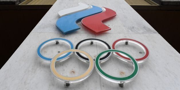 The Olympic rings are seen on the facade of the Russian Olympic Committee (ROC) building in Moscow on December 05, 2017.The International Olympic Committee (IOC) meets from Tuesday, December 5, 2017 to decide whether to bar Russia from the 2018 Winter Olympics for doping violations, in one of the weightiest decisions ever faced by the Olympic movement. / AFP PHOTO / Kirill KUDRYAVTSEV        (Photo credit should read KIRILL KUDRYAVTSEV/AFP/Getty Images)
