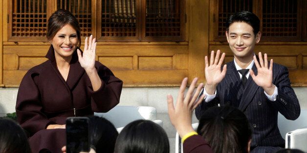 US First Lady Melania Trump (L) and Choi Min-ho, a member of South Korean boy band Shinee, wave to South Korean middle school students during the 'Girls Play 2!' Initiative, an Olympic public diplomacy outreach campaign, at the US Ambassador's Residence in Seoul on November 7, 2017.  / AFP PHOTO / POOL / Ahn Young-joon        (Photo credit should read AHN YOUNG-JOON/AFP/Getty Images)