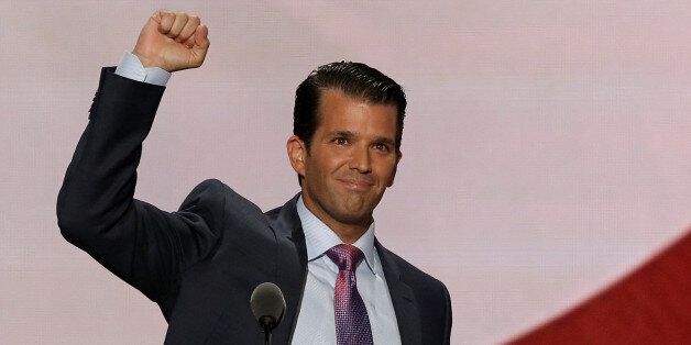 Donald Trump Jr. thrusts his fist after speaking at the 2016 Republican National Convention in Cleveland, Ohio U.S. July 19, 2016.  REUTERS/Mike Segar