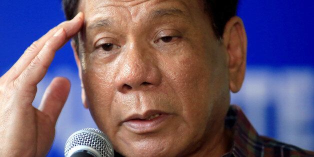 Philippines' President Rodrigo Duterte answer questions during a press briefing after awarding wounded soldiers, who fight against the insurgents of the Maute group, which has taken over large parts of the Marawi city, during his visit at the military camp hospital in Cagayan De Oro, Philippines June 11, 2017. REUTERS/Romeo Ranoco