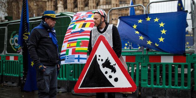 LONDON, ENGLAND - DECEMBER 13: Anti-brexit demonstrators gather with European Union flags outside the Houses of Parliament on December 13, 2017 in London, England. MPs are debating and voting on the EU withdrawal bill in Parliament today ahead of a crucial European Union council meeting tomorrow. (Photo by Jack Taylor/Getty Images)