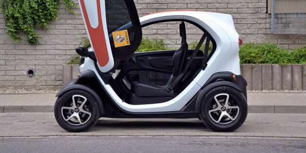 Warsaw, Poland - 6th, June, 2014: Electric micro-car Renault Twizy ZE with opening door parked on the street. Short and tight small cars are a solution to the narrow streets in many European cities.