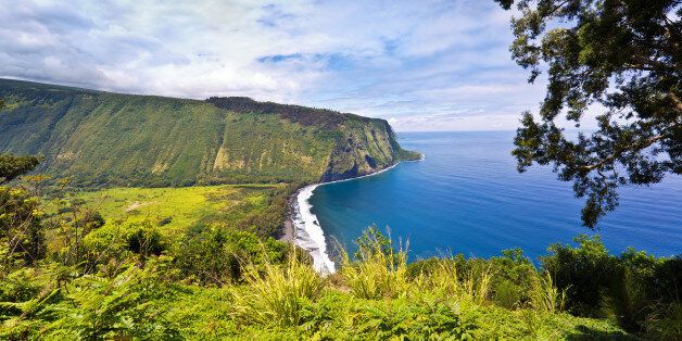 The scenic Waipi'o Valley from the Waipi'o Lookout on the north shore of the Big Island in Hawaii. A rugged shoreline with numerous waterfalls and beaches.