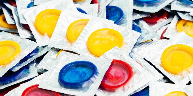 A batch of yellow, blue and red condoms.