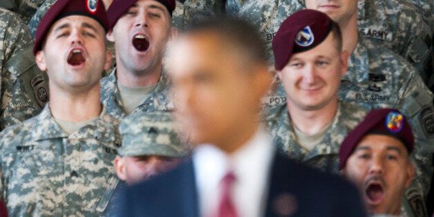 Troops yell in support at U.S. President Barack Obama as he speaks at Fort Bragg in Fayetteville, North Carolina December 14, 2011. REUTERS/Chris Keane (UNITED STATES - Tags: POLITICS MILITARY)