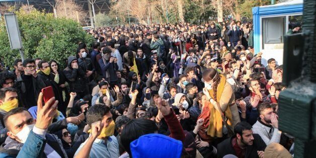 Iranian students protest at the University of Tehran during a demonstration driven by anger over economic problems, in the capital Tehran on December 30, 2017.Students protested in a third day of demonstrations, videos on social media showed, but were outnumbered by counter-demonstrators.  / AFP PHOTO / STR        (Photo credit should read STR/AFP/Getty Images)