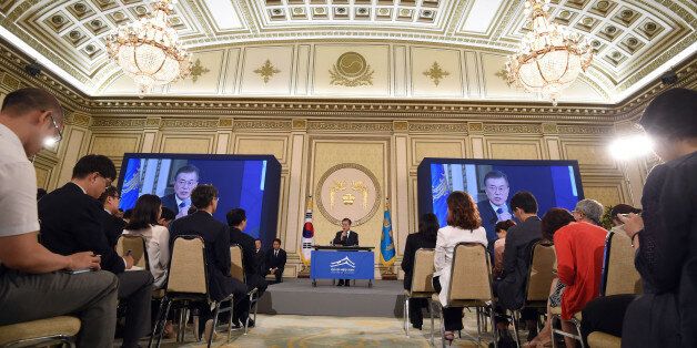 South Korea's President Moon Jae-In (C) speaks during a press conference marking his first 100 days in office at the presidential house in Seoul on August 17, 2017.There will be no war on the Korean peninsula, South Korean President Moon Jae-In said on August 17, saying Seoul effectively had a veto over US military action in response to the North's nuclear and missile programmes. / AFP PHOTO / POOL / JUNG Yeon-Je        (Photo credit should read JUNG YEON-JE/AFP/Getty Images)