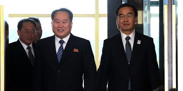 PANMUNJOM, SOUTH KOREA - JANUARY 09:  South Korean Unification Minister Cho Myoung-gyon (R) and head of North Korean delegation Ri Son-Gwon (L) walk into a meeting room before their meeting at the Panmunjom in the Demilitarized Zone on January 9, 2018 in Panmunjom, South Korea. South and North Korea are scheduled to begin their first official face-to-face talks in two years on Tuesday, January 9, 2017.  (Photo by Korea Pool/Getty Images)