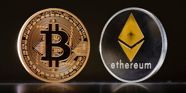 Berlin, Germany - January 09: Coins of the cryptocurrencies Ethereum and Bitcoin stands on a table on January 09, 2018 in Berlin, Germany. (Photo by Thomas Trutschel/Photothek via Getty Images)