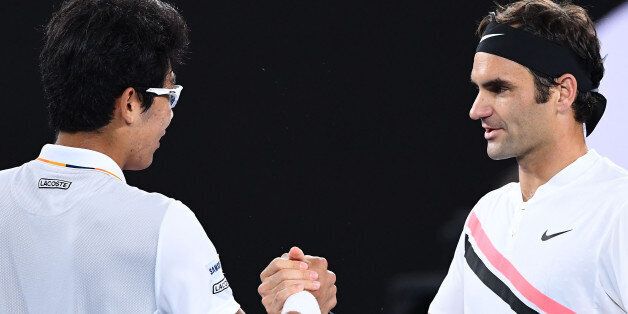 MELBOURNE, AUSTRALIA - JANUARY 26:  Hyeon Chung of South Korea shakes hands with Roger Federer of Switzerland after Chung retired hurt in their semi-final match against  on day 12 of the 2018 Australian Open at Melbourne Park on January 26, 2018 in Melbourne, Australia.  (Photo by Quinn Rooney/Getty Images)